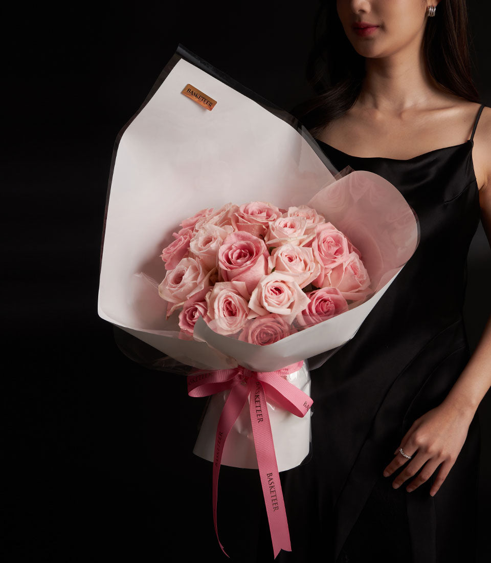 Blush pink O-Hara and Hermosa rose bouquet wrapped in white paper with pink ribbon, Valentine's Day luxury flowers