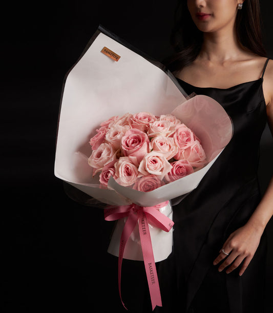 Blush pink O-Hara and Hermosa rose bouquet wrapped in white paper with pink ribbon, Valentine's Day luxury flowers