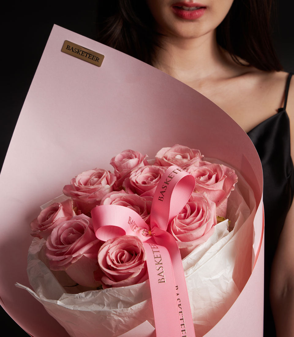 Romantic pink rose bouquet from Flowers by Basketeer. Premium Ecuador roses in soft pink paper and tied with a branded ribbon. Flower delivery Bangkok.
