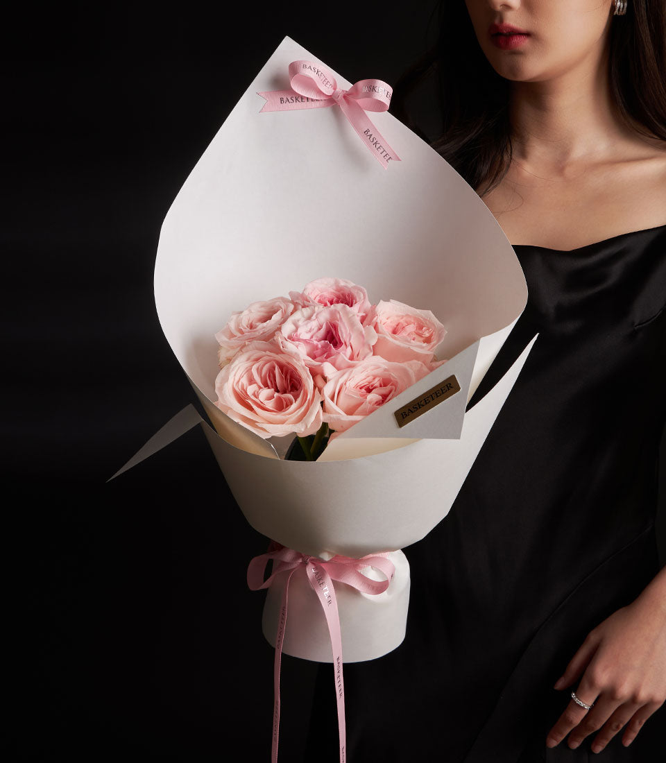 Romantic pink O'Hara rose bouquet from Flowers by Basketeer. Premium flowers Bangkok, wrapped in elegant white paper and tied with a delicate pink ribbon.
