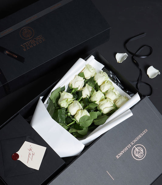 Elegant Playa Blanca white rose bouquet from Flowers by Basketeer, a luxury flower delivery Bangkok. Wrapped in crisp white paper, nestled in a premium gift box.