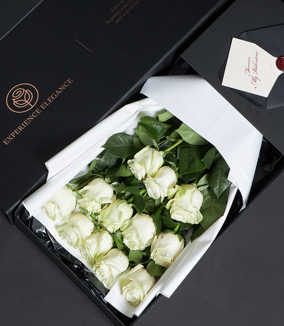 Luxury white rose bouquet in black gift box with copper rose gold branding and Forever My Valentine card for Valentine's Day