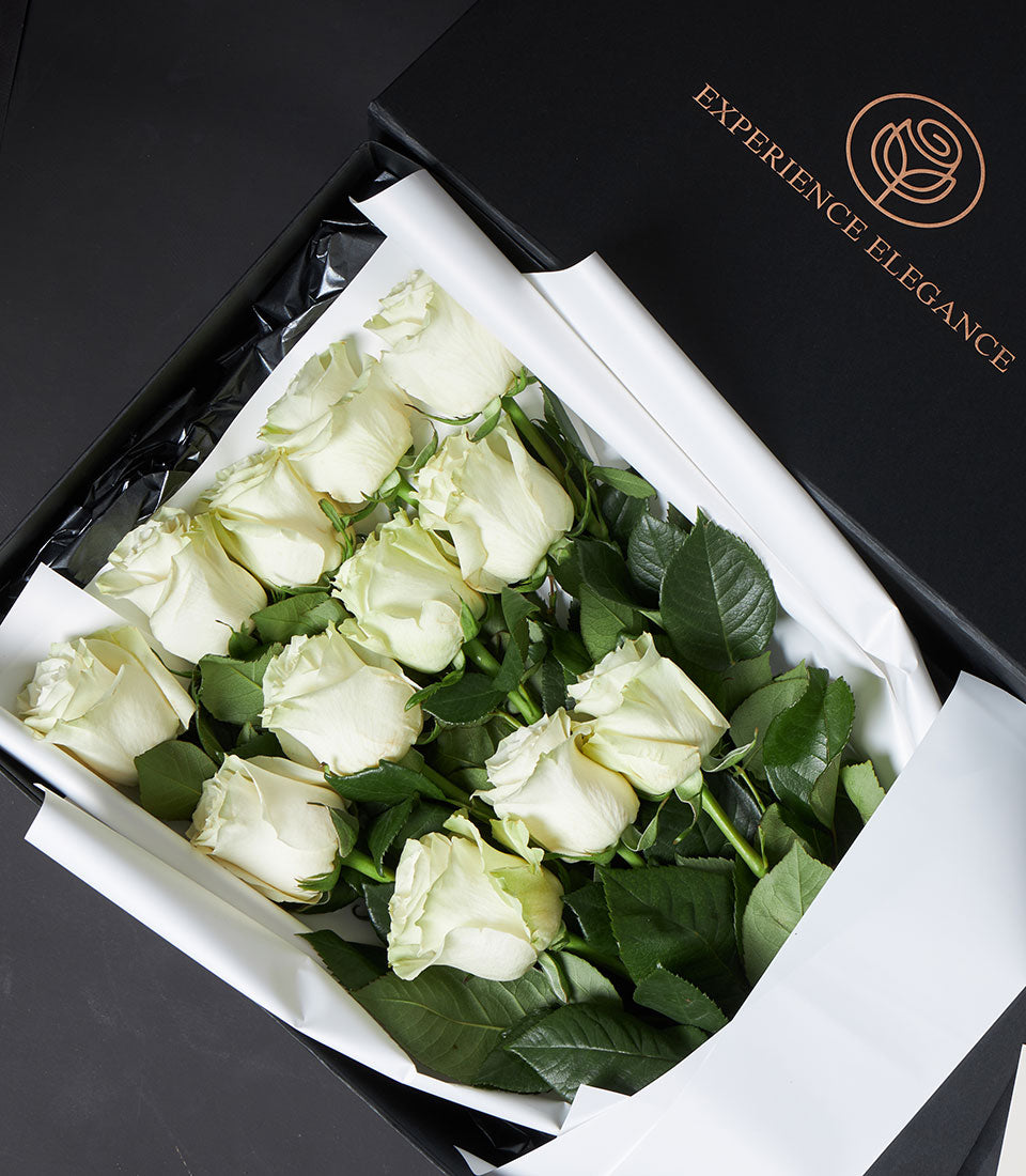 Luxury white rose bouquet in elegant black gift box with copper rose logo, Valentine's Day gift