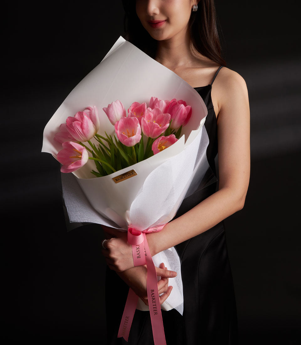 Premium pink tulips Valentine bouquet with white mesh wrapping and pink ribbon