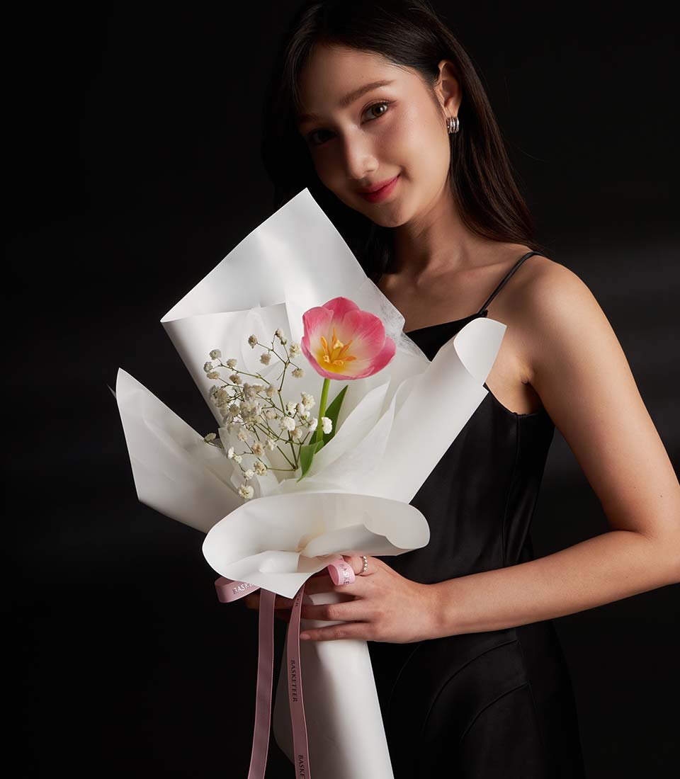 Pink tulip and baby's breath Valentine bouquet with white wrap and ribbon