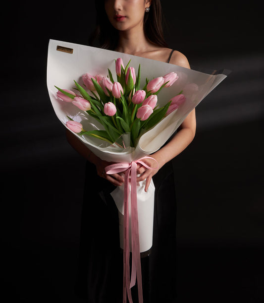 Pink tulip Valentine bouquet with satin ribbon and white wrap