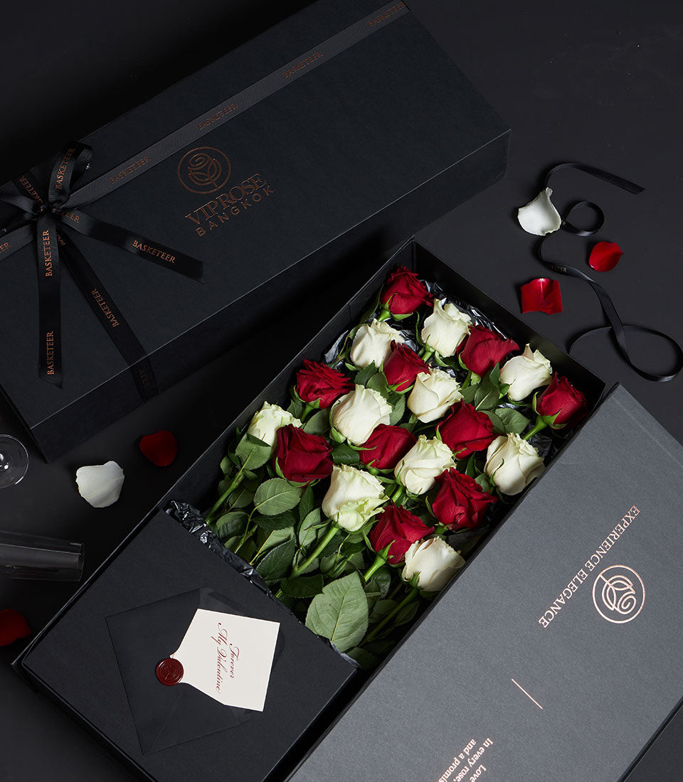 Red and white Ecuador roses in luxury black gift box with satin ribbon, Valentine's Day arrangement