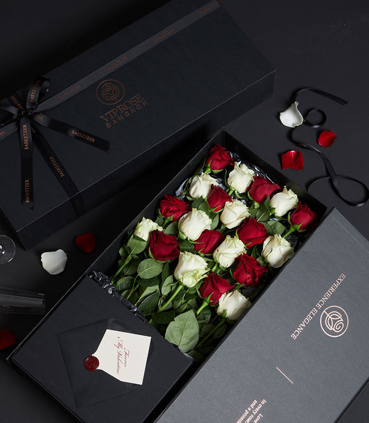 Red and white Ecuador roses in luxury black gift box with satin ribbon, Valentine's Day arrangement