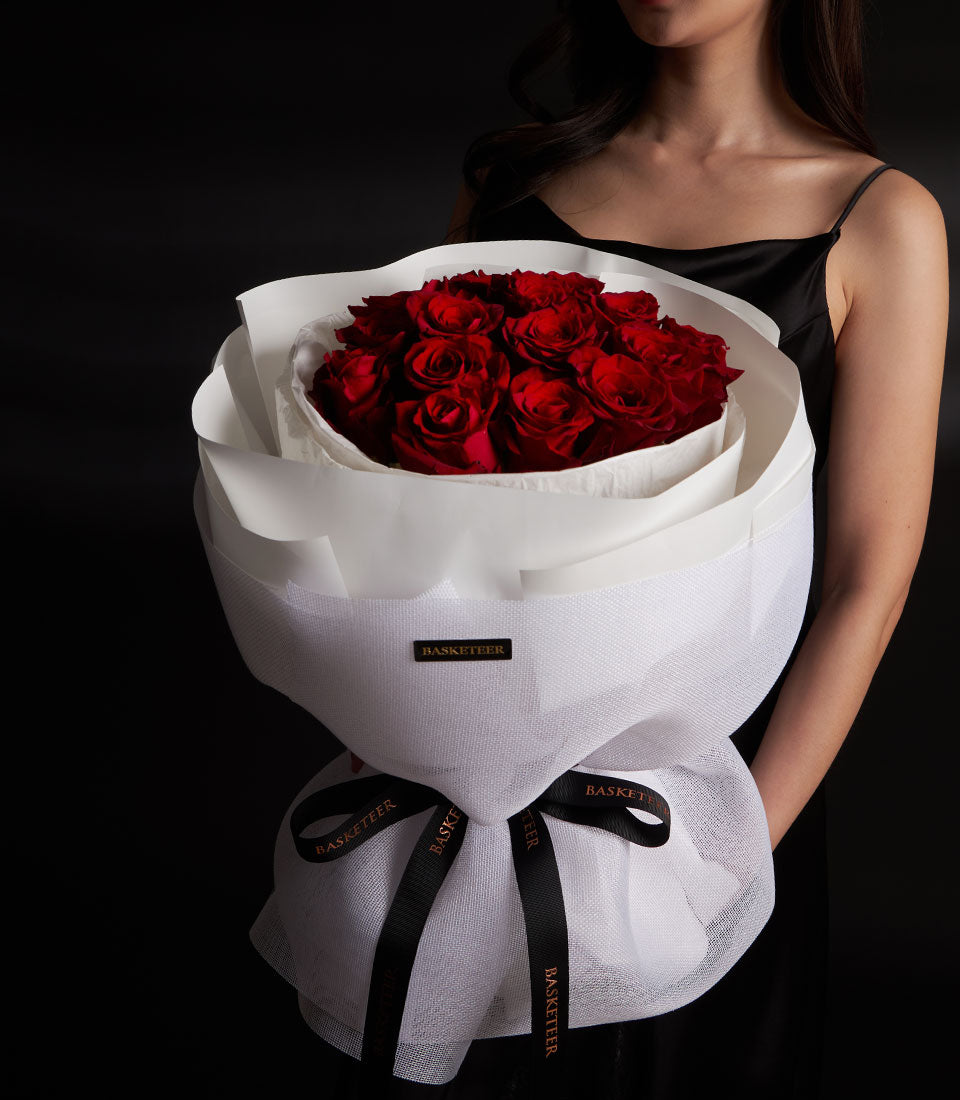 Luxe Ecuador red rose Valentine's bouquet with white mesh wrapping and black Basketeer ribbon bow