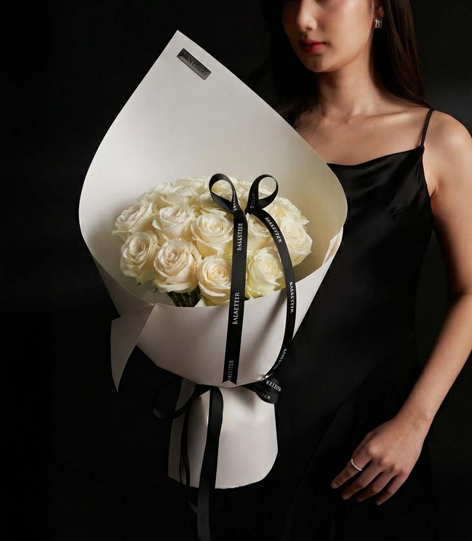 Playa Blanca white rose bouquet with cream wrapping and black ribbon, Valentine's Day gift