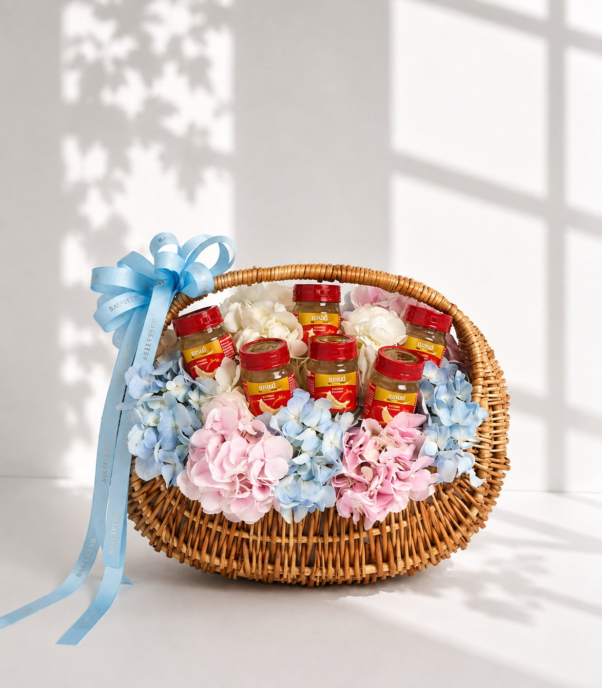A luxurious Basketeer gift basket featuring seven premium bird's nest drinks nestled among