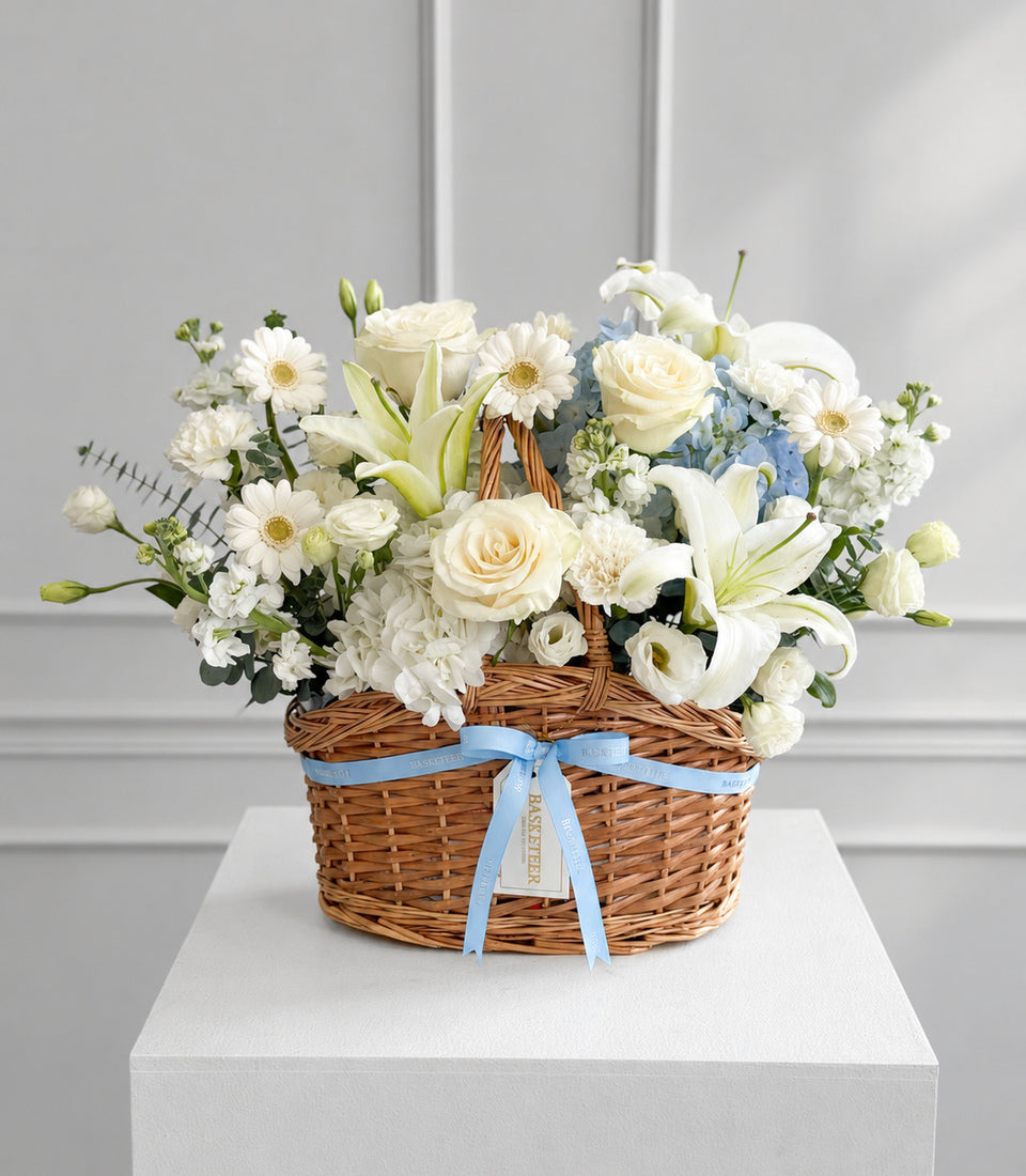 Basketeer's luxurious flower gift basket brimming with white roses