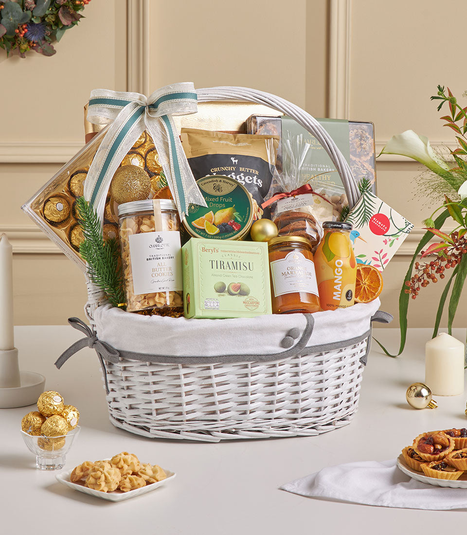 Luxury New Year gourmet hamper with chocolates, cookies, and premium treats in white wicker basket