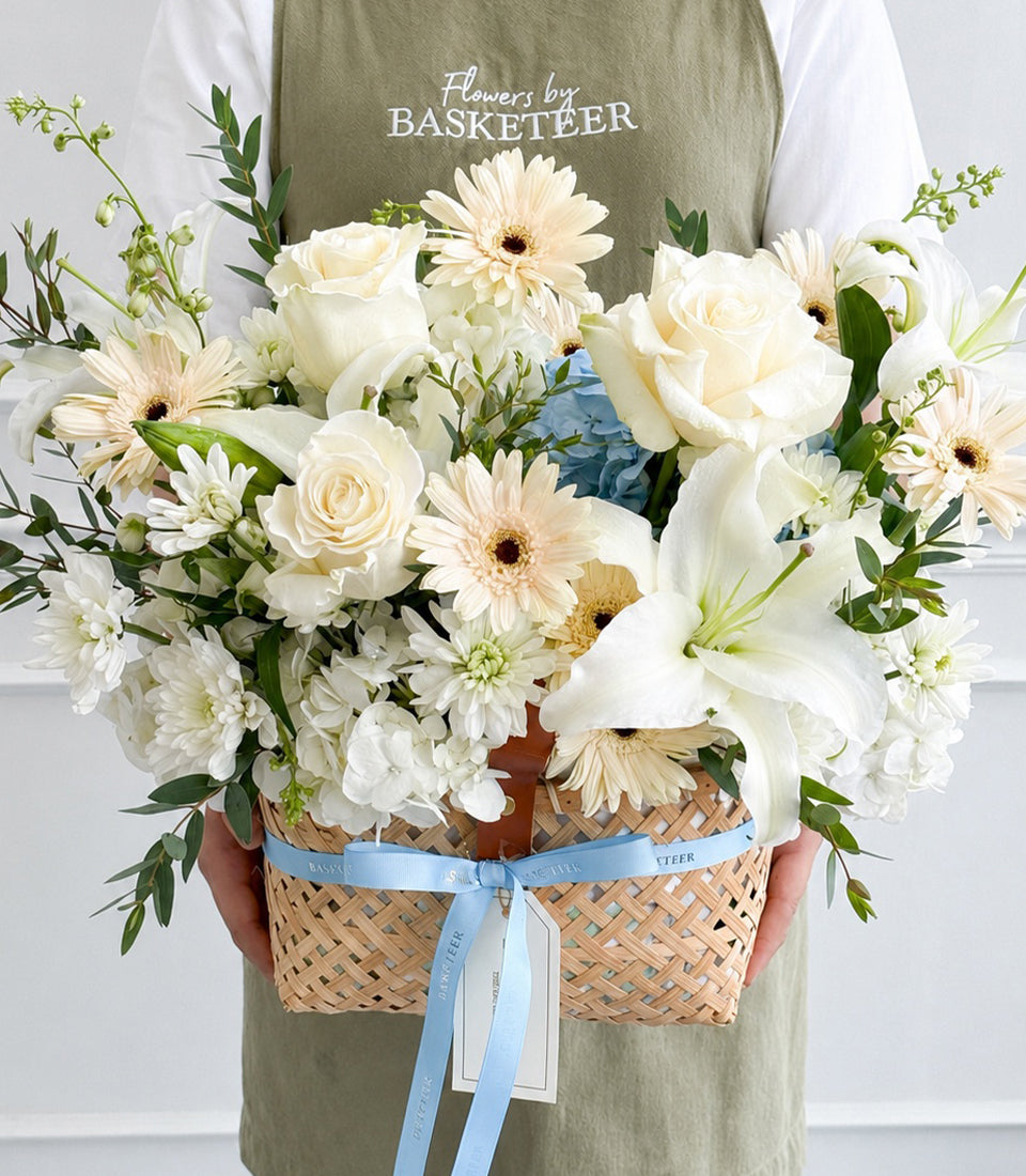 Elegant flower basket from Flowers by Basketeer, featuring premium white roses, lilies