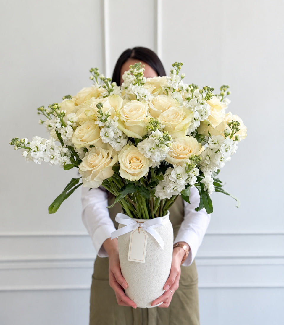 Elegant ivory rose and white stock vase arrangement, a premium flower delivery from Flowers