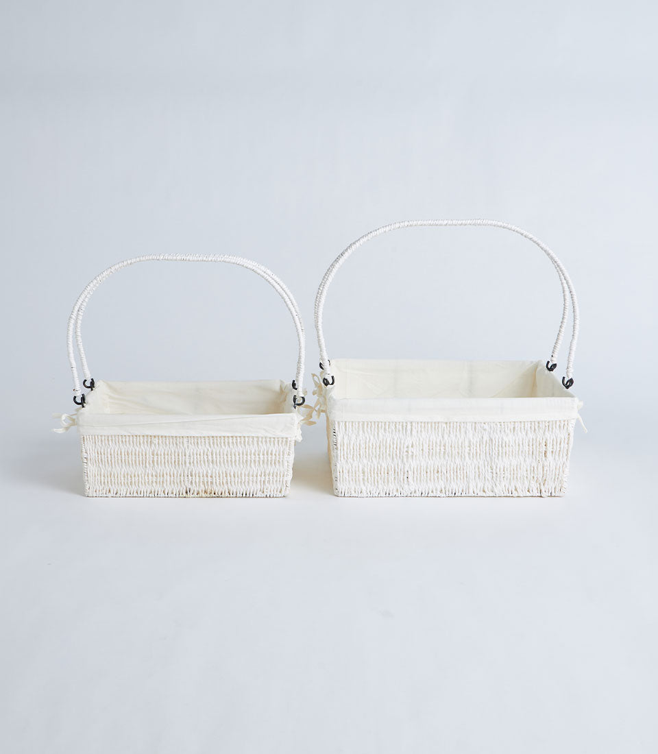 Natural wicker gift baskets with cream fabric lining and arched handles, set of two sizes