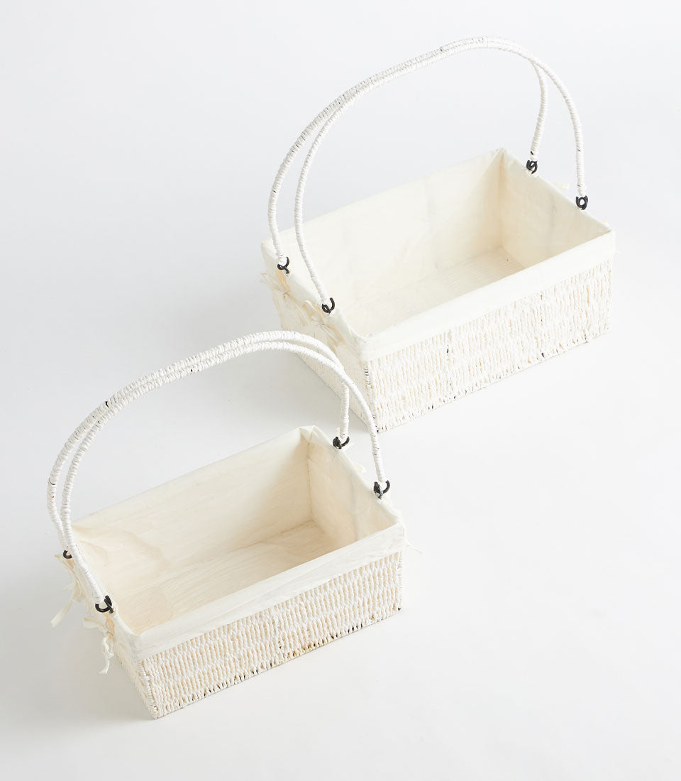 Natural woven white basket with cream fabric liner and dual handles for luxury gift presentations