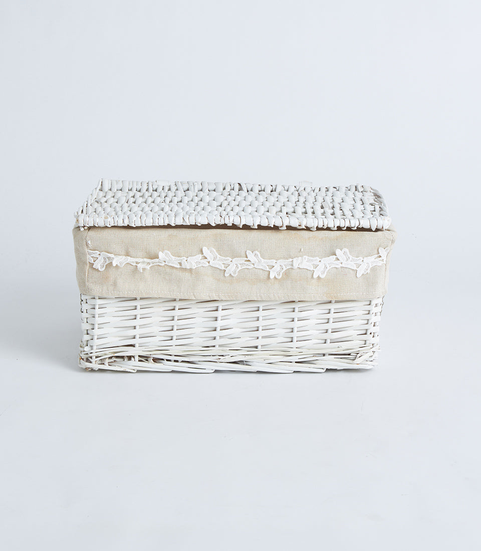 White wicker storage basket with lace trim and fabric liner, elegant rustic design