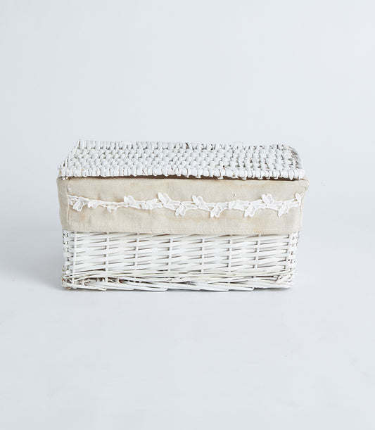 White wicker storage basket with lace trim and fabric liner, elegant rustic design