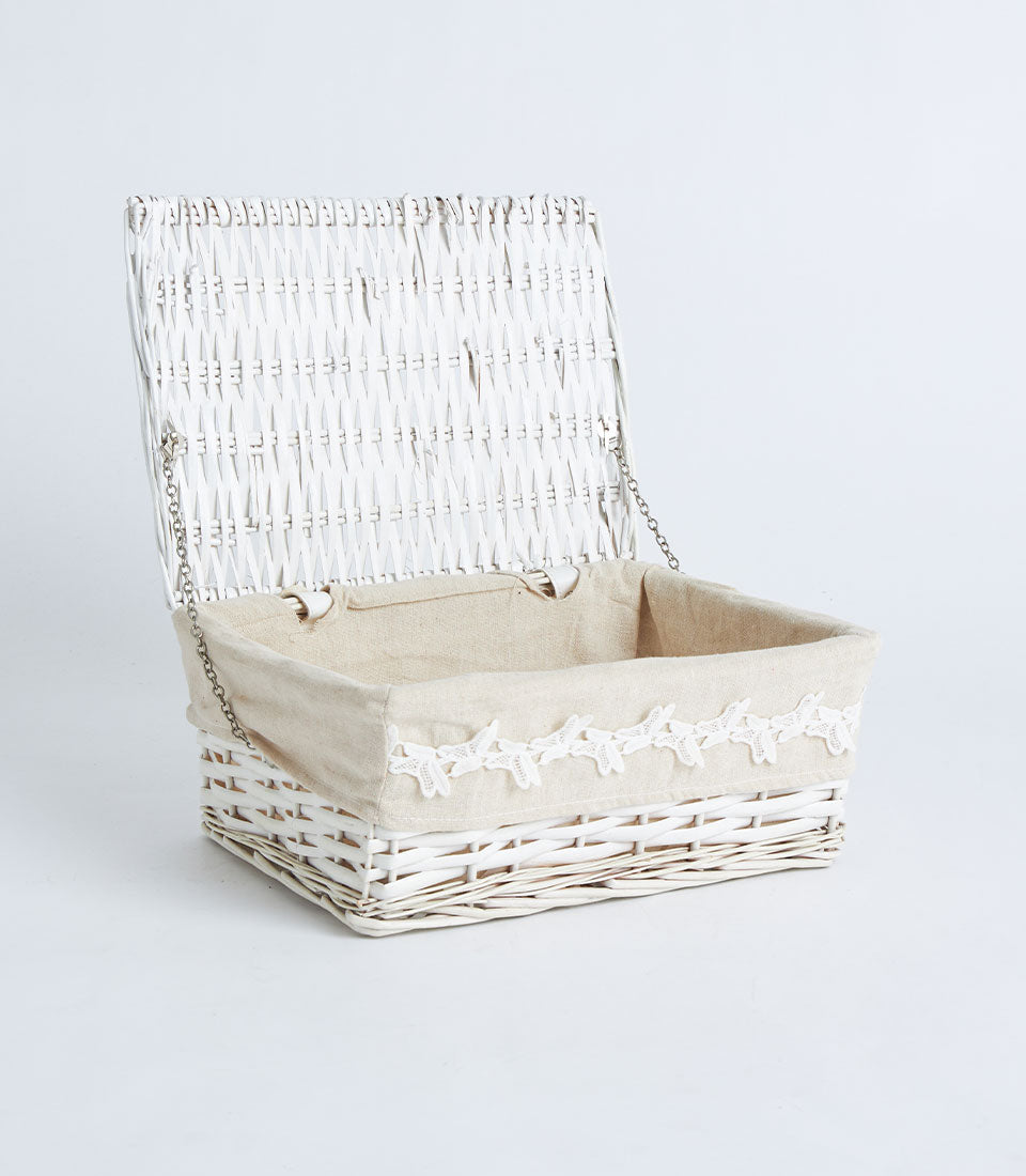 White wicker storage basket with hinged lid and lace-trimmed beige liner
