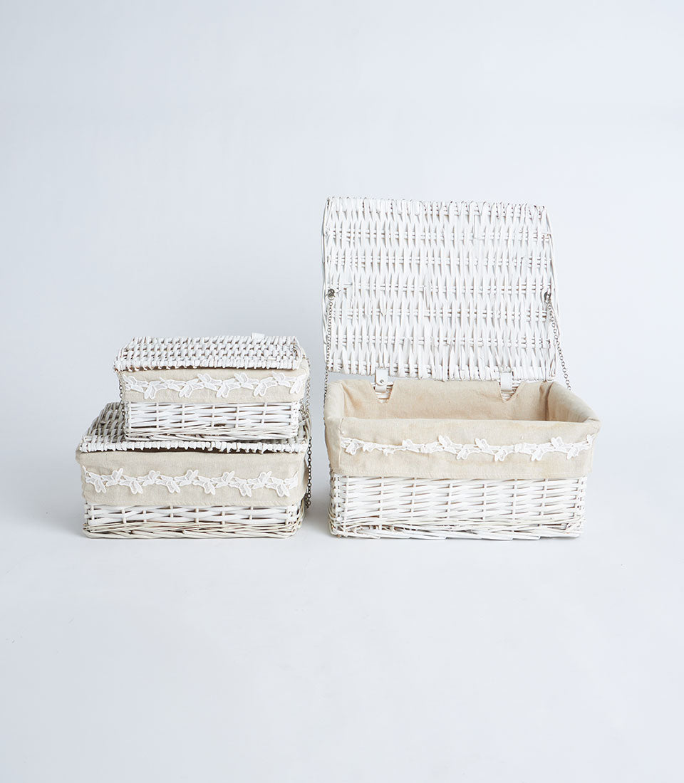 Basketeer's charming set of three white wicker storage baskets, each with