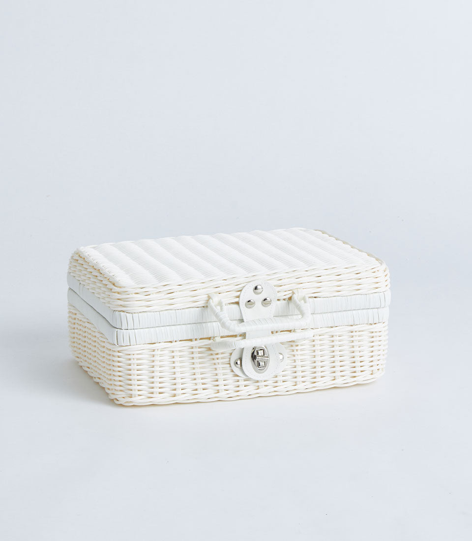 White wicker suitcase basket with silver clasp and faux leather handle