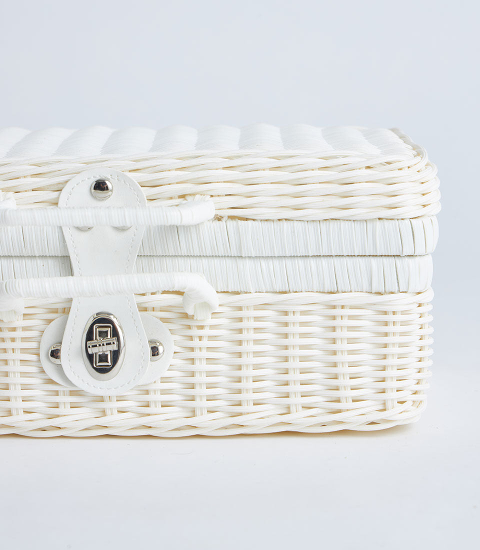 White wicker suitcase basket with faux leather strap and silver clasp, perfect for luxury gift hampers and premium storage