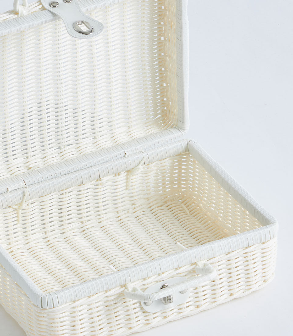 White wicker suitcase basket with silver clasp, hinged lid open