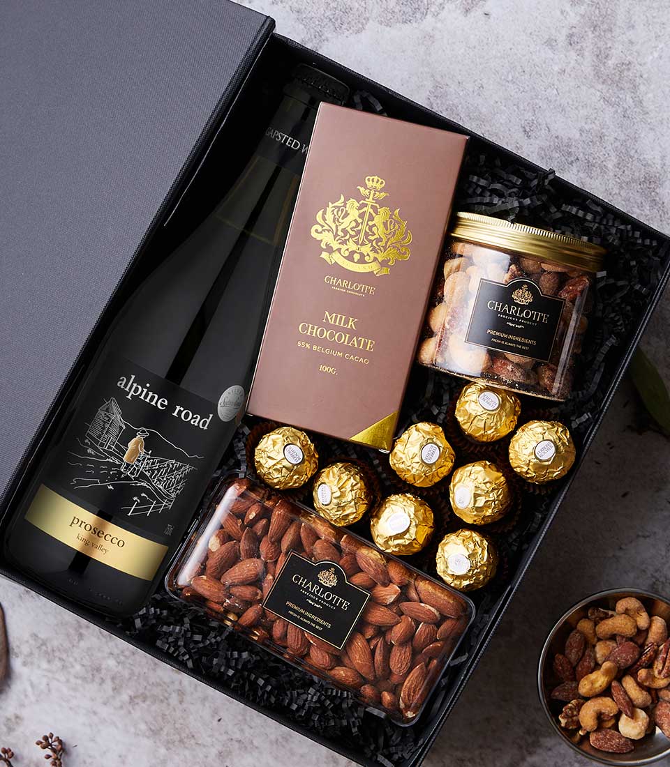 Luxury wine and chocolate gift set with Prosecco, Belgian milk chocolate, and gourmet nuts in black presentation box