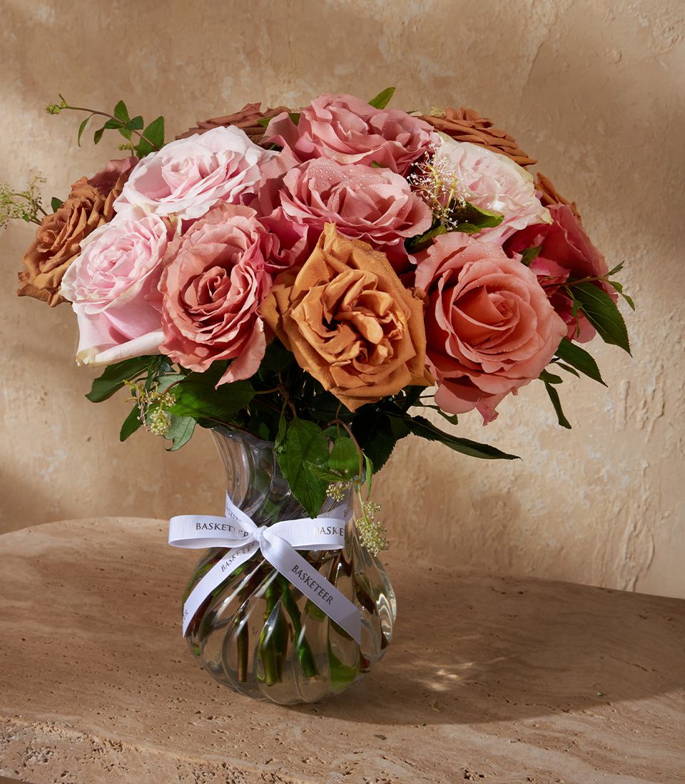 Premium pink, peach, and brown rose bouquet in fluted glass vase with velour finish
